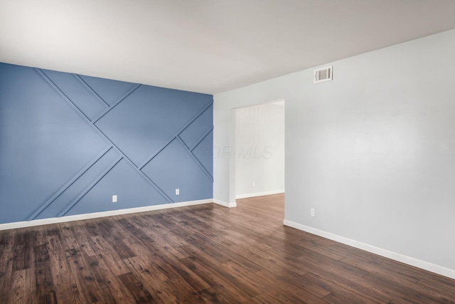 5186 Meadowbrook Dr, Columbus, OH 43207 - unfurnished room with baseboards and dark wood-style flooring