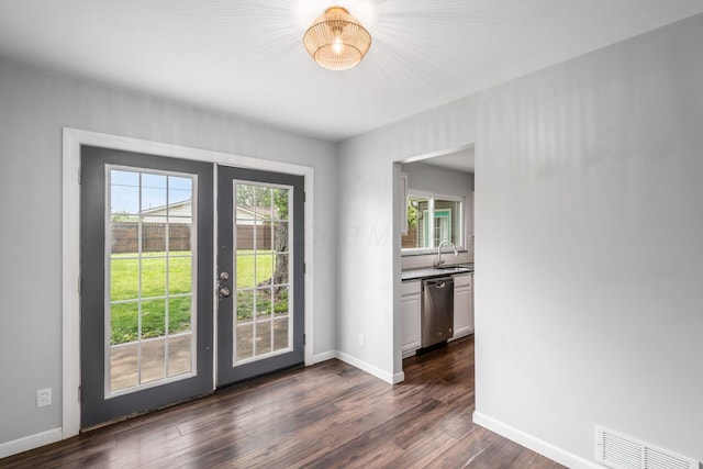 5186 Meadowbrook Dr, Columbus, OH 43207 - doorway with a sink, french doors, dark wood finished floors, and baseboards