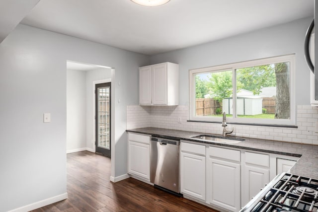 5186 Meadowbrook Dr, Columbus, OH 43207 - kitchen with dishwasher, a sink, decorative backsplash, white cabinets, and dark wood-style floors