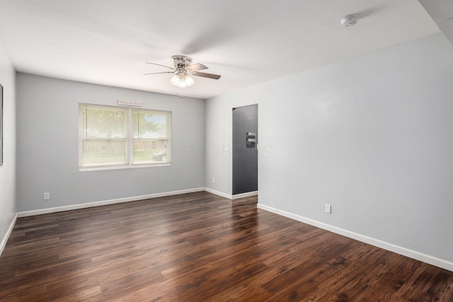 5186 Meadowbrook Dr, Columbus, OH 43207 - unfurnished room featuring ceiling fan, a smoke detector, dark wood finished floors, and baseboards