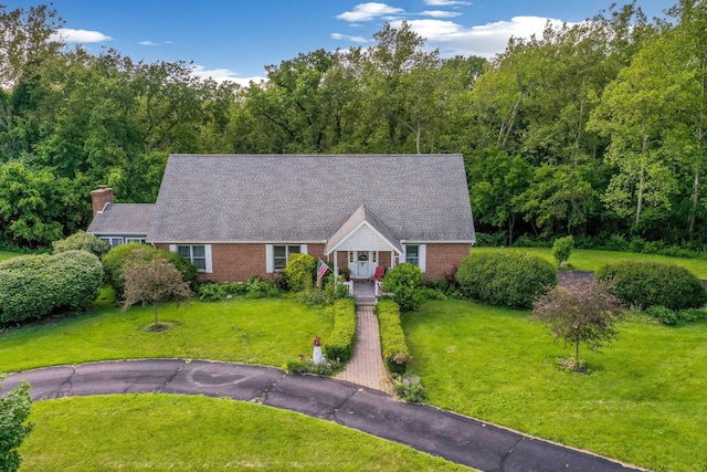445 Cedar Hill Rd SW, Amanda, OH 43102 - view of front of house featuring a front yard, brick siding, a porch, and a chimney