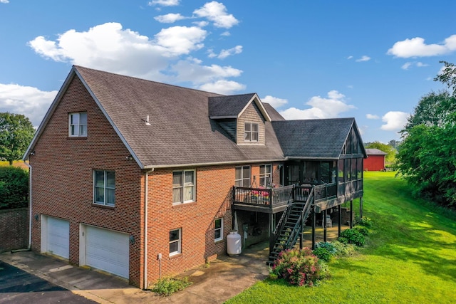 445 Cedar Hill Rd SW, Amanda, OH 43102 - back of house with stairs, a yard, an attached garage, a deck, and brick siding