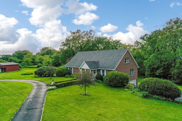 445 Cedar Hill Rd SW, Amanda, OH 43102 - view of front of home featuring brick siding, a front yard, a garage, and driveway
