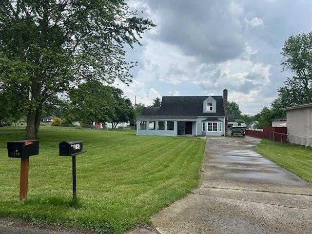 135 Rumsey Rd, Columbus, OH 43207 - view of front of property featuring driveway and a chimney