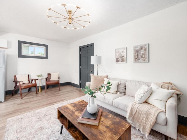 1432 Cordell Ave, Columbus, OH 43211 - living room featuring light wood-style floors and a chandelier
