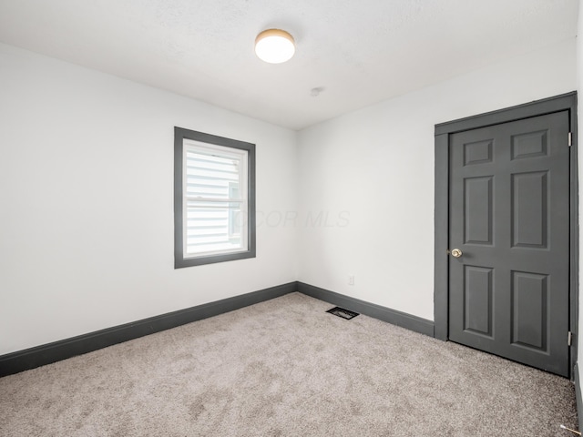 1432 Cordell Ave, Columbus, OH 43211 - spare room with carpet flooring and baseboards