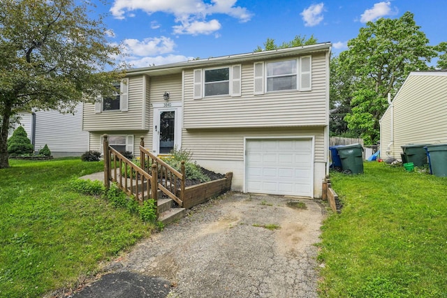 3840 Farm Brook Ln, Columbus, OH 43204 - bi-level home featuring asphalt driveway, a garage, and a front lawn
