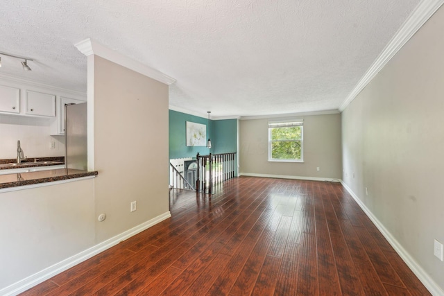 3840 Farm Brook Ln, Columbus, OH 43204 - unfurnished room featuring dark wood-style floors, crown molding, and a textured ceiling