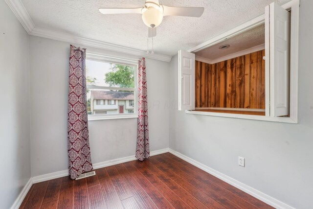 3840 Farm Brook Ln, Columbus, OH 43204 - spare room featuring a textured ceiling, wood-type flooring, a ceiling fan, and crown molding