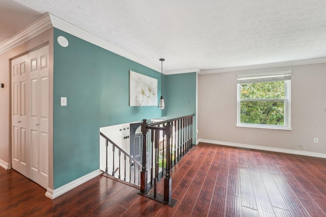 3840 Farm Brook Ln, Columbus, OH 43204 - corridor with an upstairs landing, hardwood / wood-style floors, a textured ceiling, and ornamental molding