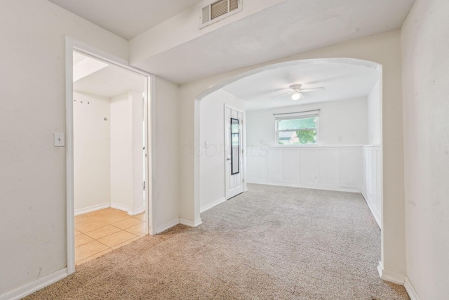 3840 Farm Brook Ln, Columbus, OH 43204 - carpeted spare room with arched walkways and a ceiling fan