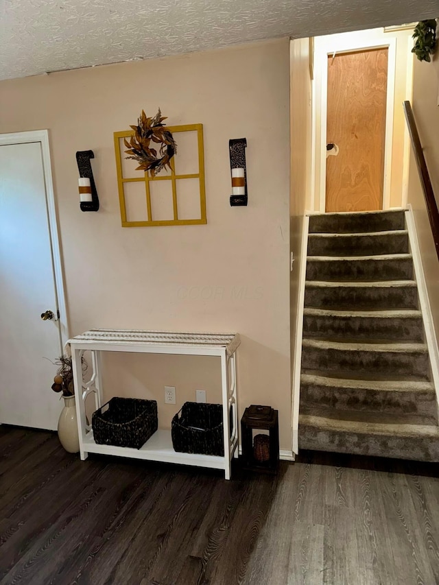 375 Darby Ct, Galloway, OH 43119 - stairway with wood finished floors and a textured ceiling