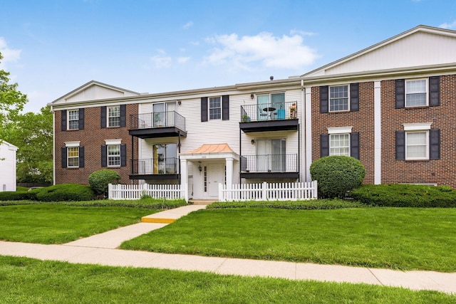 1530 Slade Ave Unit 101, Columbus, OH 43235 - townhome / multi-family property featuring a front lawn and brick siding