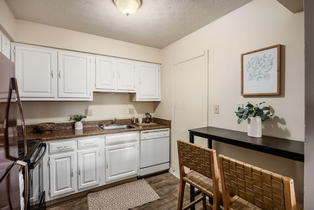 1530 Slade Ave Unit 101, Columbus, OH 43235 - kitchen featuring black appliances, a sink, white cabinets, dark countertops, and dark wood-type flooring
