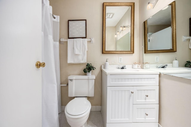 1530 Slade Ave Unit 101, Columbus, OH 43235 - full bath with toilet, vanity, tile patterned floors, and baseboards
