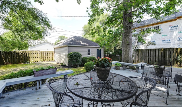 259 N Stanwood Rd, Columbus, OH 43209 - deck with outdoor dining area, a fenced backyard, and an outdoor structure