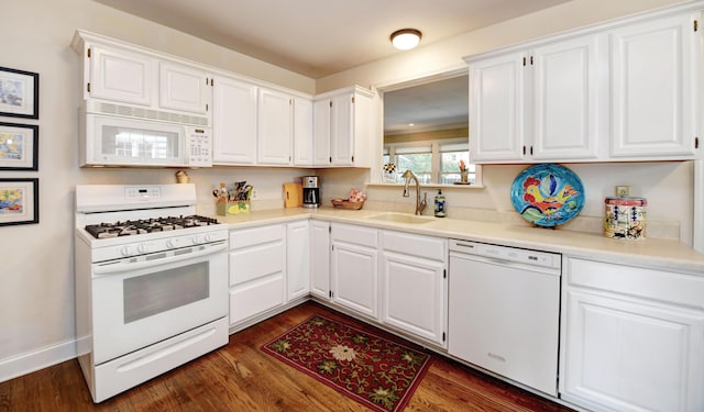 259 N Stanwood Rd, Columbus, OH 43209 - kitchen featuring white appliances, white cabinets, dark wood-type flooring, and light countertops