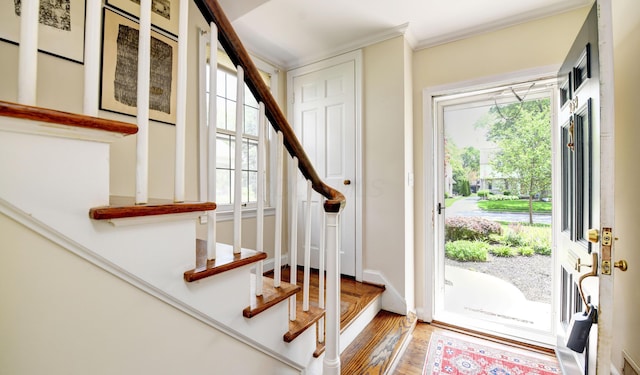 259 N Stanwood Rd, Columbus, OH 43209 - foyer entrance featuring stairway, light wood-style floors, and ornamental molding