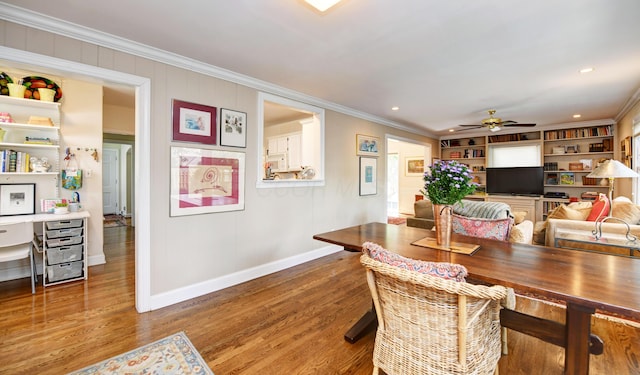 259 N Stanwood Rd, Columbus, OH 43209 - dining area with ornamental molding, wood finished floors, a ceiling fan, built in shelves, and recessed lighting