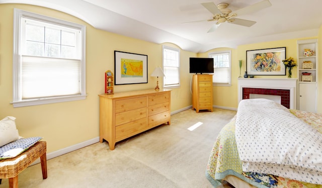 259 N Stanwood Rd, Columbus, OH 43209 - bedroom with light carpet, a ceiling fan, a tile fireplace, and vaulted ceiling