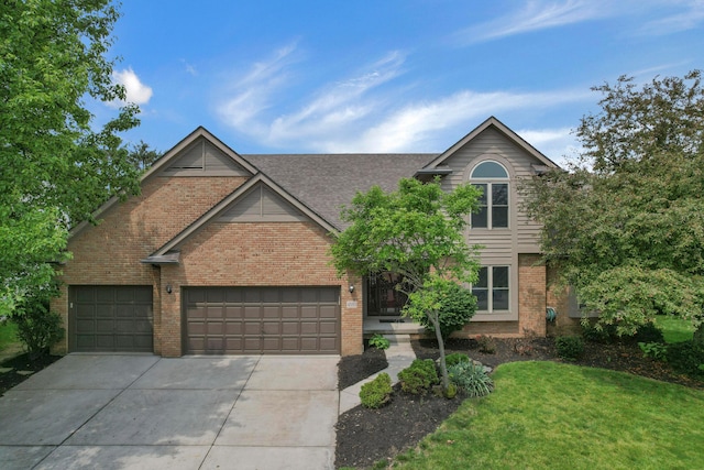 4583 Hunting Creek Dr, Grove City, OH 43123 - traditional-style house with brick siding, driveway, a garage, a front yard, and roof with shingles