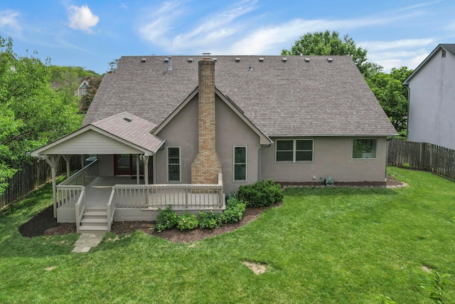 4583 Hunting Creek Dr, Grove City, OH 43123 - back of property with stucco siding, a shingled roof, a chimney, and a wooden deck