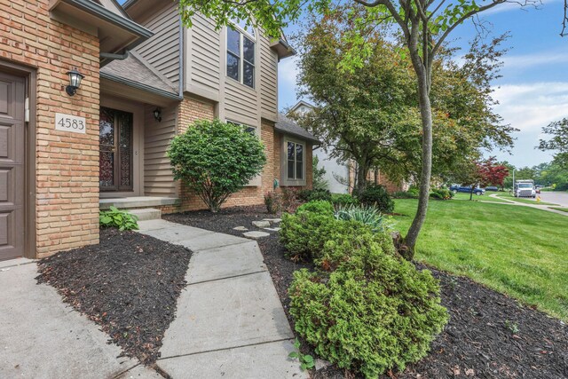 4583 Hunting Creek Dr, Grove City, OH 43123 - property entrance with brick siding and a lawn