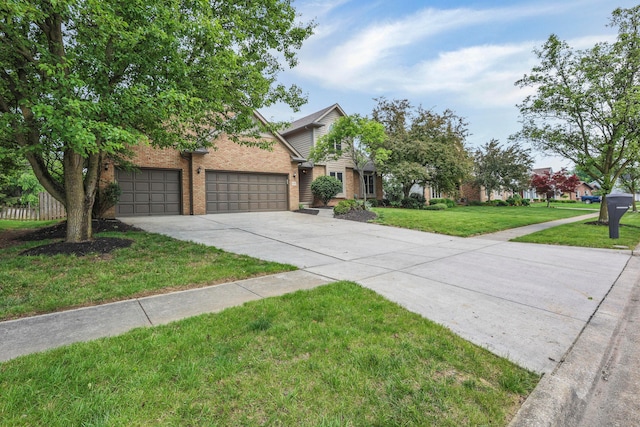 4583 Hunting Creek Dr, Grove City, OH 43123 - view of property hidden behind natural elements with brick siding, driveway, a front yard, and an attached garage