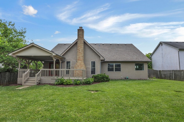 4583 Hunting Creek Dr, Grove City, OH 43123 - rear view of house featuring stucco siding, a shingled roof, a chimney, and a wooden deck