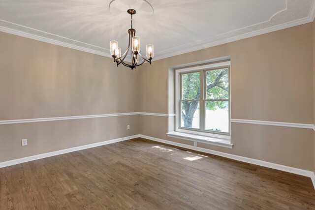 4583 Hunting Creek Dr, Grove City, OH 43123 - empty room featuring baseboards, a chandelier, dark wood-style flooring, and ornamental molding