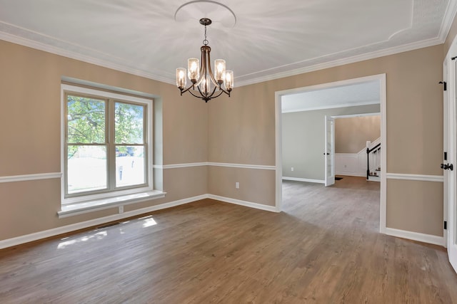 4583 Hunting Creek Dr, Grove City, OH 43123 - spare room with a chandelier, wood finished floors, ornamental molding, stairs, and baseboards