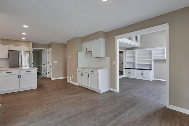 4583 Hunting Creek Dr, Grove City, OH 43123 - kitchen with freestanding refrigerator, light countertops, baseboards, white cabinets, and recessed lighting
