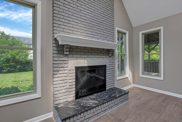 4583 Hunting Creek Dr, Grove City, OH 43123 - detailed view of baseboards, wood finished floors, and a fireplace