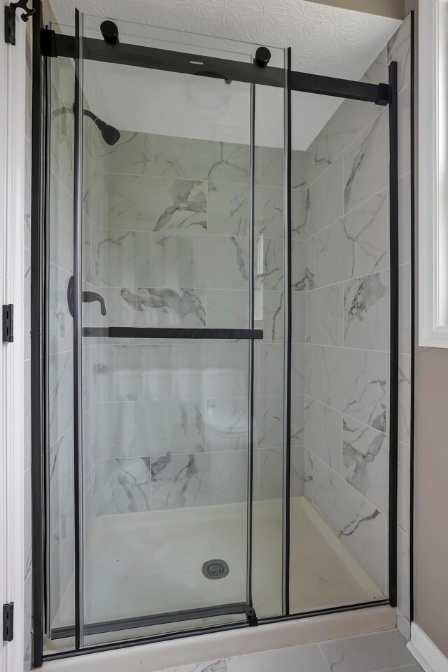 4583 Hunting Creek Dr, Grove City, OH 43123 - bathroom with a marble finish shower and marble look tile flooring