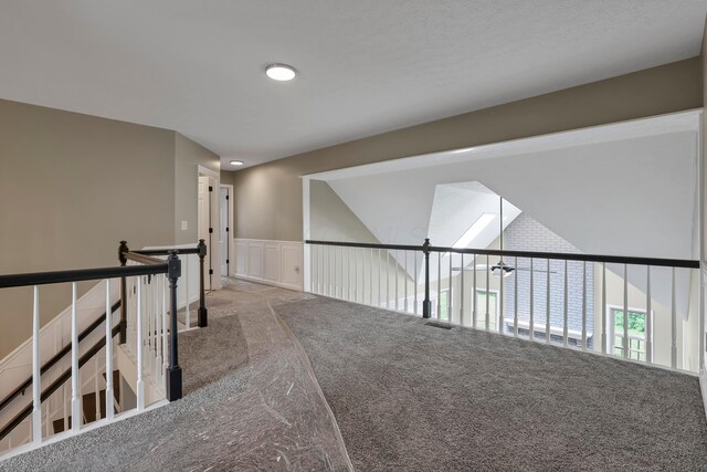 4583 Hunting Creek Dr, Grove City, OH 43123 - corridor featuring carpet floors, a wainscoted wall, and an upstairs landing