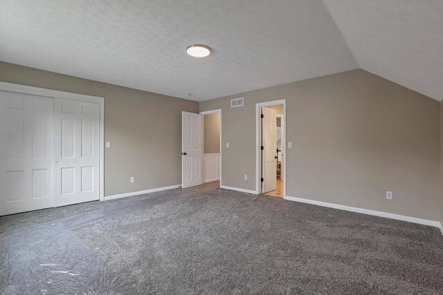 4583 Hunting Creek Dr, Grove City, OH 43123 - unfurnished bedroom featuring carpet floors, baseboards, a closet, a textured ceiling, and vaulted ceiling