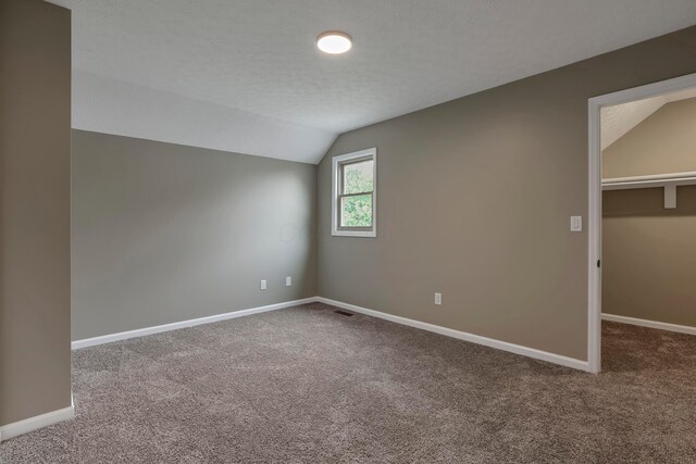 4583 Hunting Creek Dr, Grove City, OH 43123 - unfurnished bedroom with lofted ceiling, carpet flooring, and baseboards
