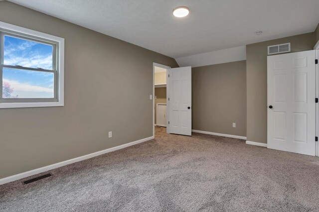 4583 Hunting Creek Dr, Grove City, OH 43123 - unfurnished bedroom featuring carpet flooring, baseboards, and lofted ceiling