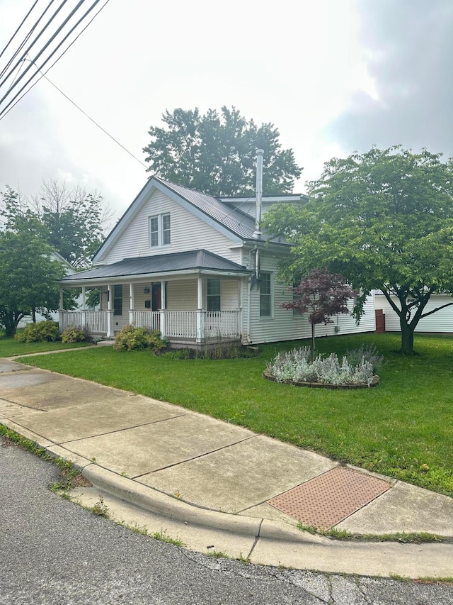 287 W Columbus St, Mount Sterling, OH 43143 - view of front of home featuring covered porch and a front lawn