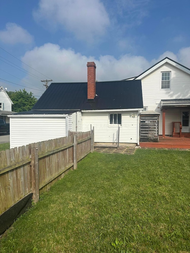 287 W Columbus St, Mount Sterling, OH 43143 - back of house featuring a chimney, metal roof, and a deck