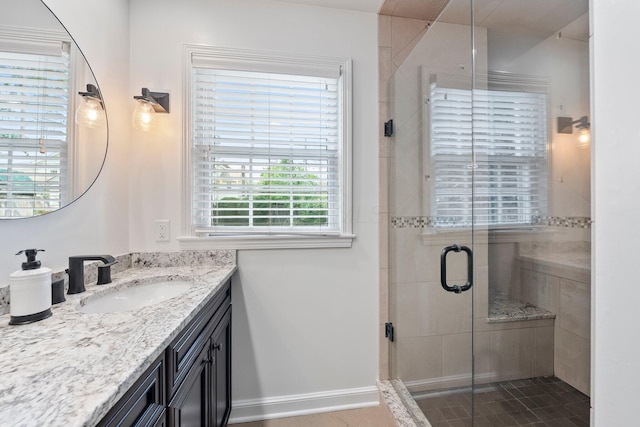 1572 Barrington Rd, Upper Arlington, OH 43221 - full bathroom with vanity, a stall shower, tile patterned floors, and baseboards