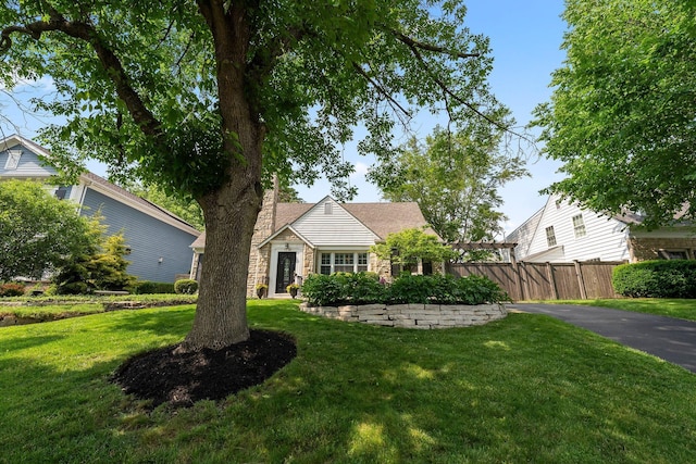 1572 Barrington Rd, Upper Arlington, OH 43221 - view of front of house featuring stone siding and a chimney