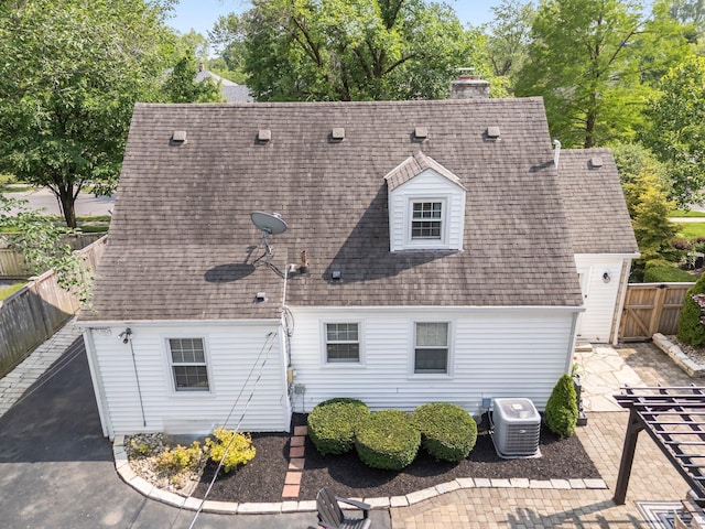 1572 Barrington Rd, Upper Arlington, OH 43221 - rear view of property featuring central AC, a patio area, a chimney, and a shingled roof