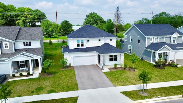 3895 Brody Dr, Grove City, OH 43123 - traditional-style house featuring asphalt driveway, covered porch, a front yard, and a garage
