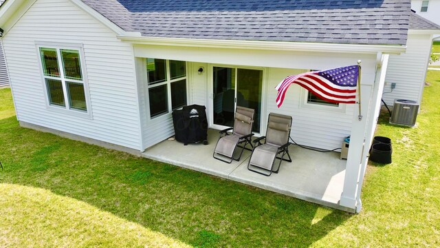 3895 Brody Dr, Grove City, OH 43123 - back of house with a shingled roof, central AC, a yard, and a patio area