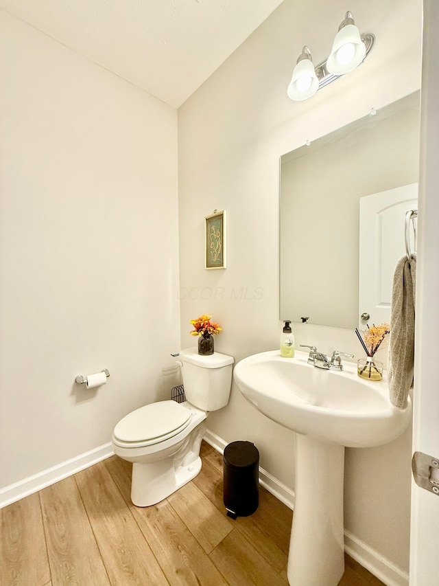 3895 Brody Dr, Grove City, OH 43123 - bathroom featuring toilet, wood finished floors, and baseboards