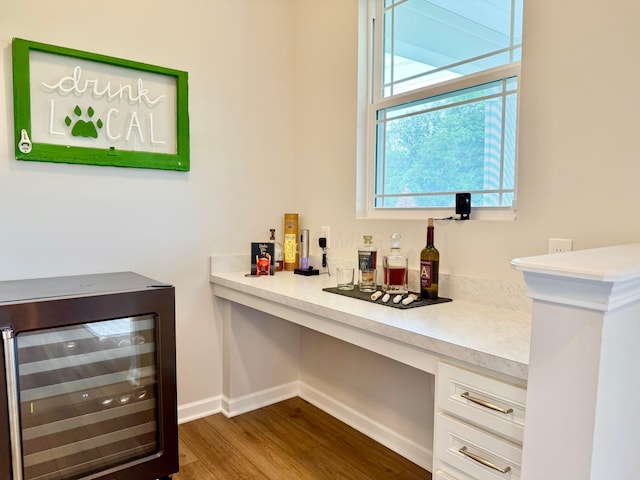 3895 Brody Dr, Grove City, OH 43123 - indoor dry bar with wine cooler, dark wood-style floors, and baseboards