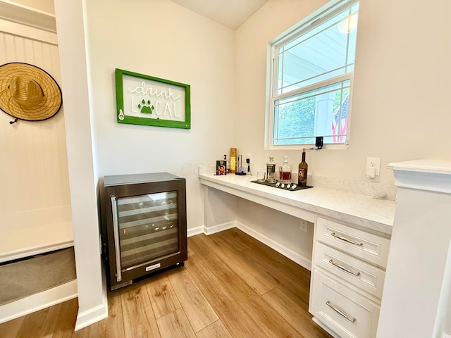 3895 Brody Dr, Grove City, OH 43123 - office with beverage cooler, light wood finished floors, a dry bar, and baseboards