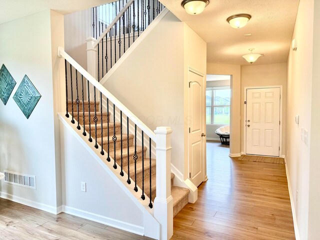3895 Brody Dr, Grove City, OH 43123 - staircase with wood finished floors and baseboards