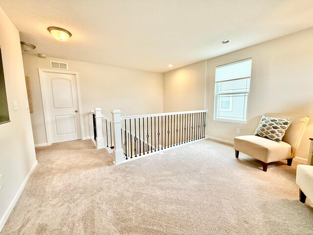 3895 Brody Dr, Grove City, OH 43123 - living area with an upstairs landing, carpet, and baseboards